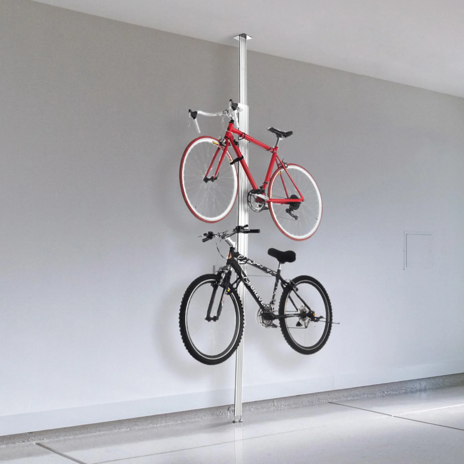 Two bikes on the floor-to-ceiling pole rack