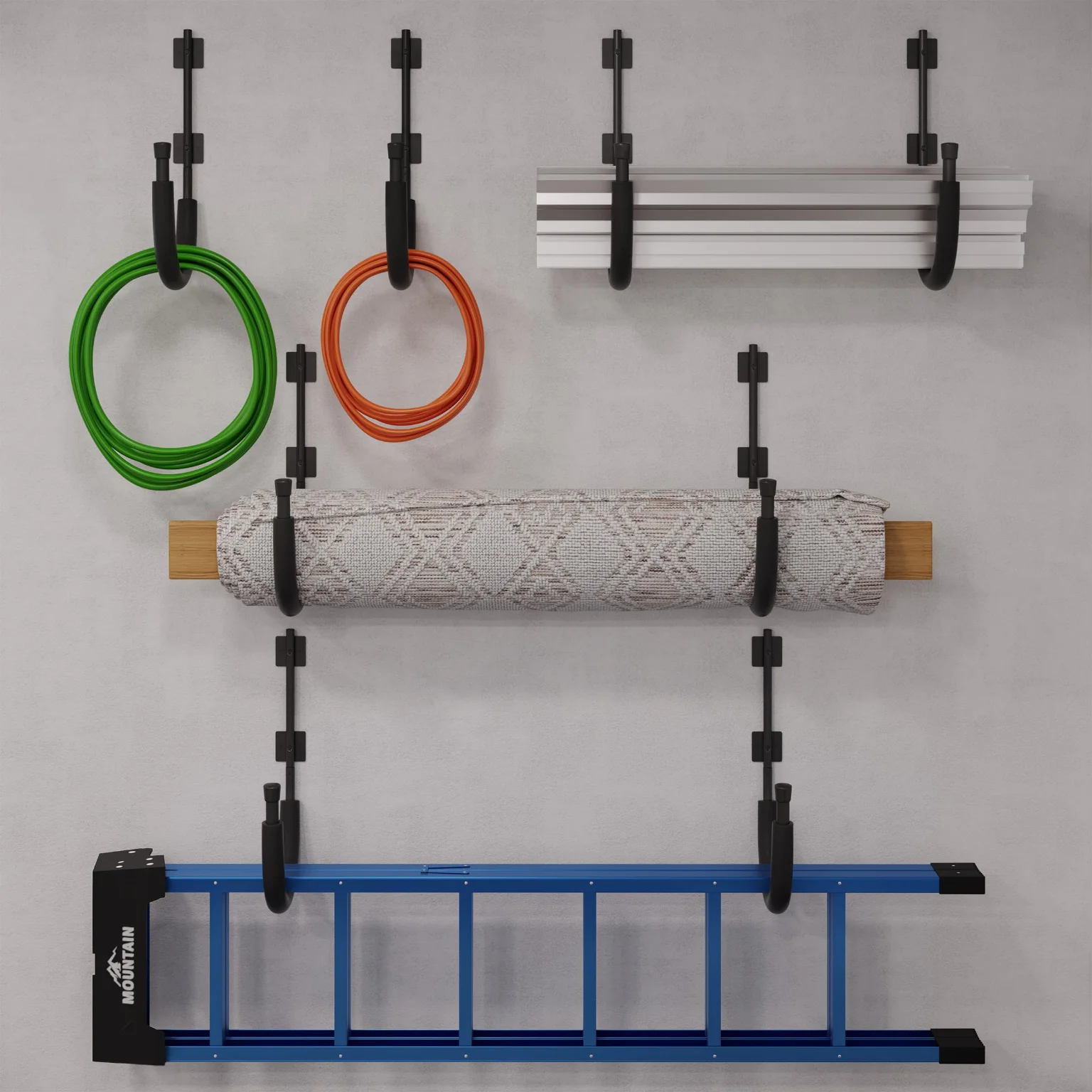 Hoses, a rug and a ladder on garage hooks