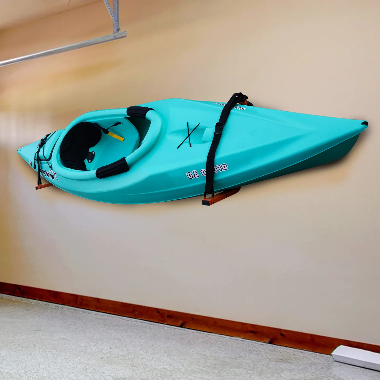 A kayak in the strapped wall hangers